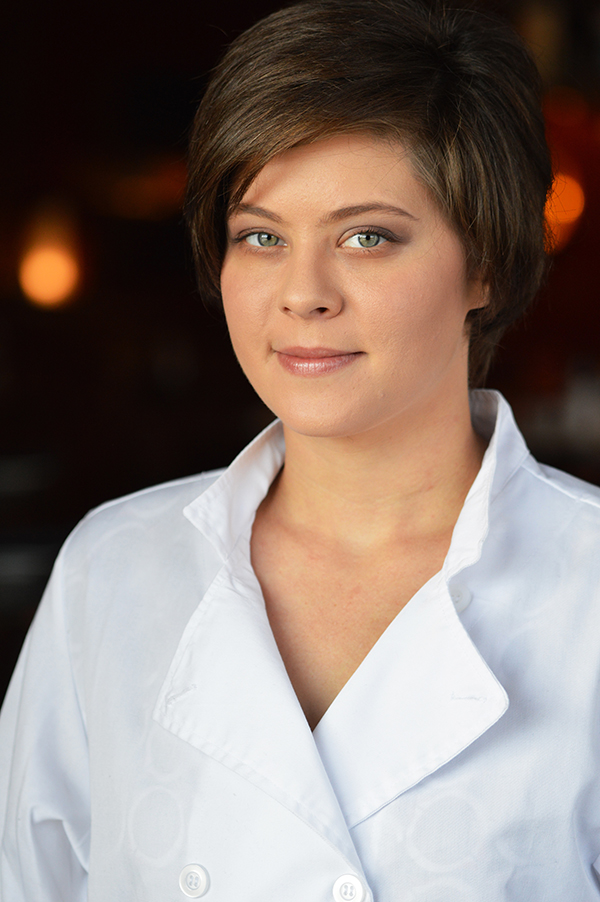 A lovely soft headshot of a woman with short hair
